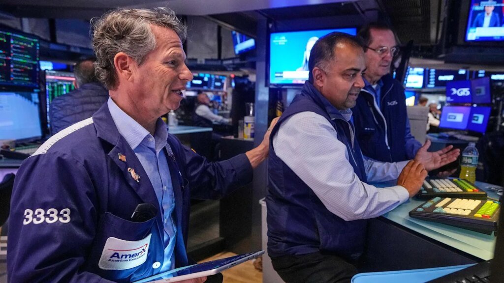 Wall Street hovers near records ahead of earnings, inflation data this week