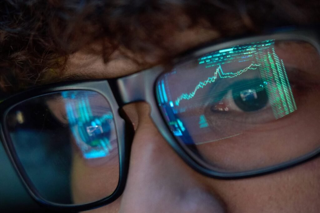 a person watches stock market trades