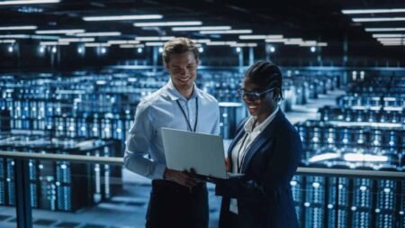 rewrite this title in other words: The AI Boom Needs Data Centres: 2 TSX Stocks to Watch Closely Data center servers IT workers