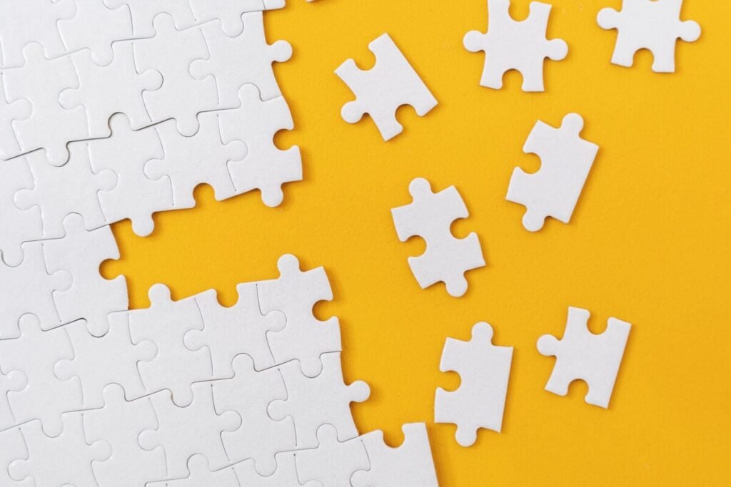 How I’m Organizing My $7,000 TFSA for Consistent Monthly Income Partially complete jigsaw puzzle with scattered missing pieces