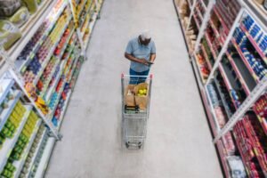 A High Dividend Yield May Signal Caution: Here’s the Reason Why man shops at grocery store