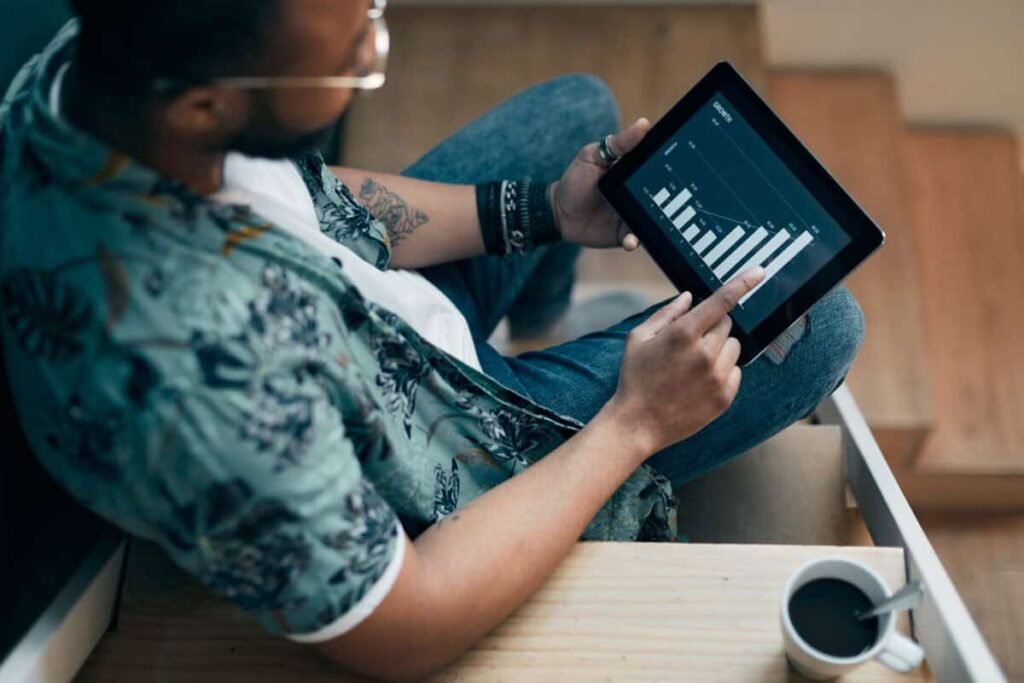 Introduction to Brokerage Accounts: Key Considerations for New Canadian Investors An investor uses a tablet